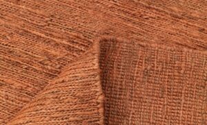 Handwoven Burnt Orange Jute Rug with Minimal Textured Weave