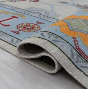 Modern Pastel Tribal Geometric Knotted Wool Rug with Blue Border